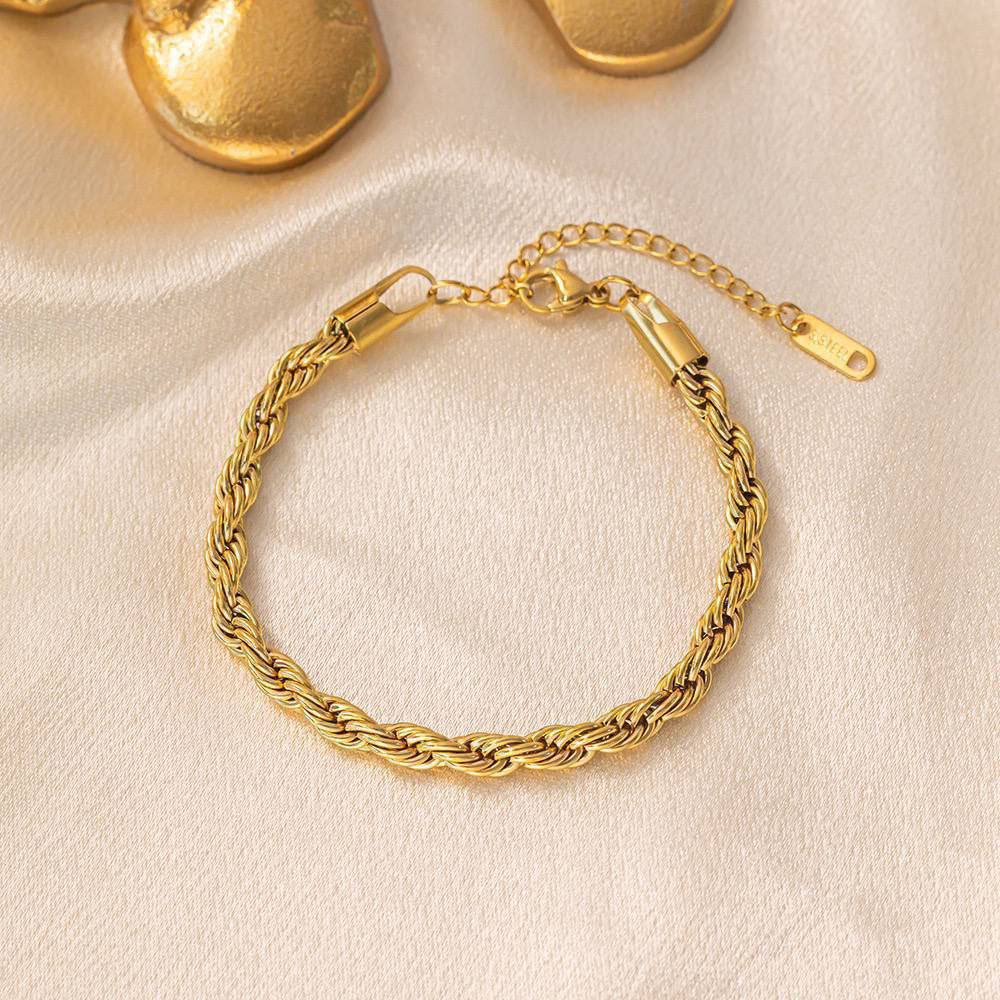 أسورة ستانلس ستيل دهبي بتصميم ضفيرة